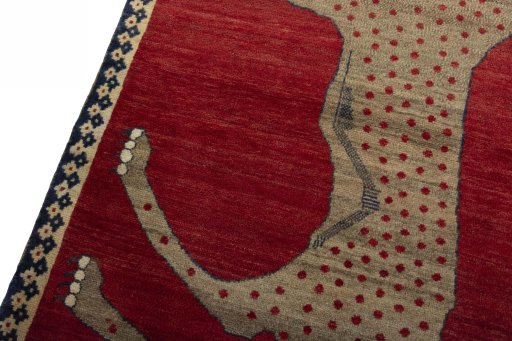 Backside of handmade 2000s Persian Gabbeh rug showing knot structure and weave density