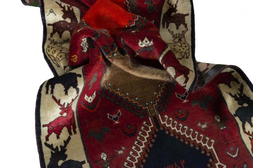 Corner detail of 2000s Persian Gabbeh rug showing border pattern and Wool pile