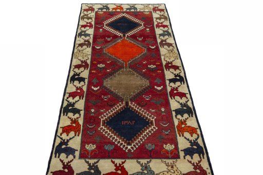 Surface texture of 2000s Persian Gabbeh rug with natural Wool and intricate pattern