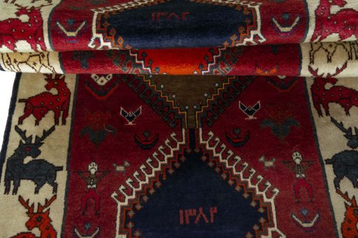 Full view of 2000s Persian Gabbeh rug from Iran / Persia, 256 × 100 cm in Red tones