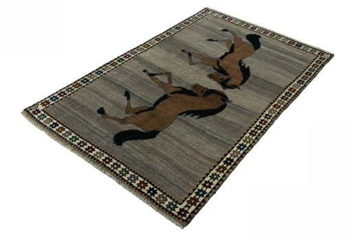 Corner detail of 2000s Persian Gabbeh rug showing border pattern and Wool pile
