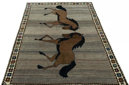 Surface texture of 2000s Persian Gabbeh rug with natural Wool and intricate pattern