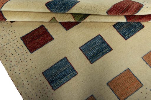 Full view of 2000s Persian Gabbeh rug from Iran / Persia, 200 × 153 cm in Beige tones