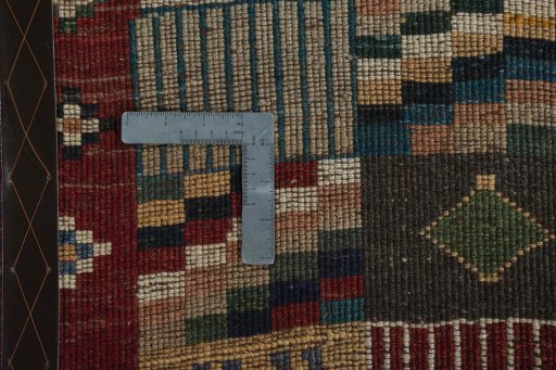 Close-up detail of 2000s Persian Gabbeh rug from Iran / Persia showing Wool weave