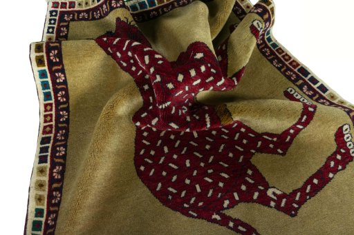 Corner detail of 2000s Persian Gabbeh rug showing border pattern and Wool pile