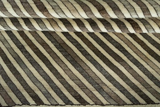Full view of 2000s Persian Gabbeh rug from Iran / Persia, 190 × 118 cm in Beige tones