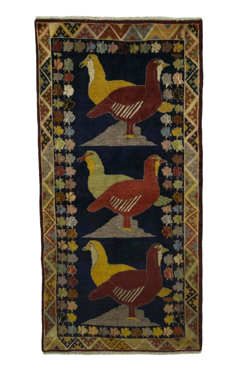 Full view of 2000s Persian Gabbeh rug from Iran / Persia, 215 × 106 cm in Blue tones