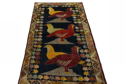 Surface texture of 2000s Persian Gabbeh rug with natural Wool and intricate pattern