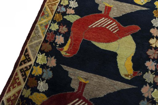Backside of handmade 2000s Persian Gabbeh rug showing knot structure and weave density