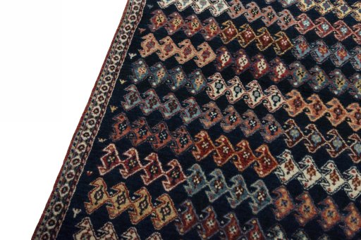Backside of handmade 2000s Persian Gabbeh rug showing knot structure and weave density