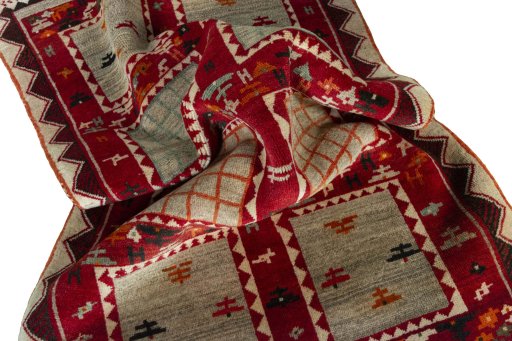 Corner detail of 2000s Persian Gabbeh rug showing border pattern and Wool pile