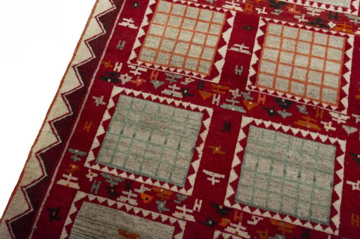Backside of handmade 2000s Persian Gabbeh rug showing knot structure and weave density