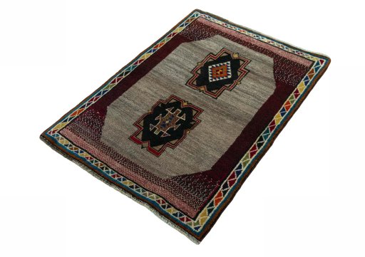 Corner detail of 2000s Persian Gabbeh rug showing border pattern and Wool pile