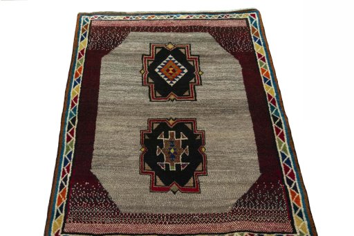 Surface texture of 2000s Persian Gabbeh rug with natural Wool and intricate pattern