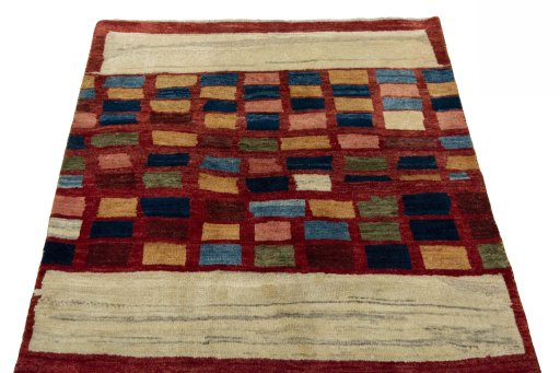 Surface texture of 2000s Persian Gabbeh rug with natural Wool and intricate pattern