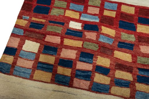 Backside of handmade 2000s Persian Gabbeh rug showing knot structure and weave density