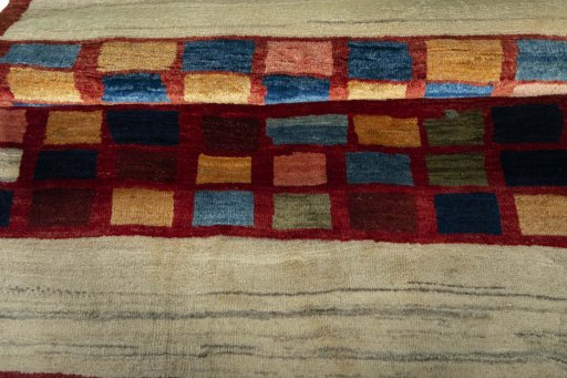 Full view of 2000s Persian Gabbeh rug from Iran / Persia, 117 × 105 cm in Red tones