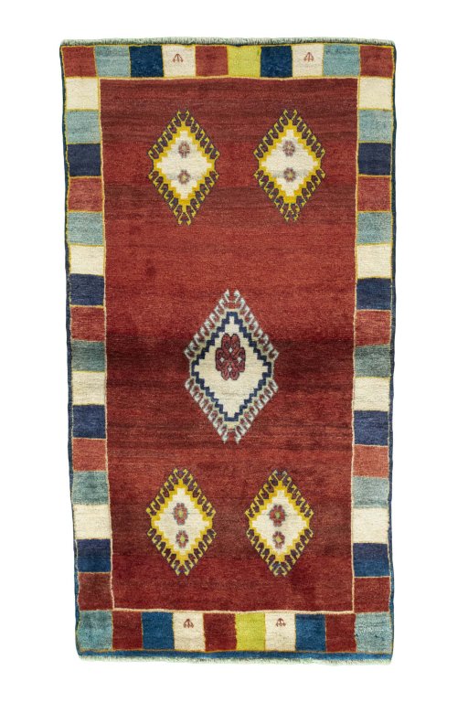 Full view of 2000s Persian Gabbeh rug from Iran / Persia, 193 × 104 cm in Red tones