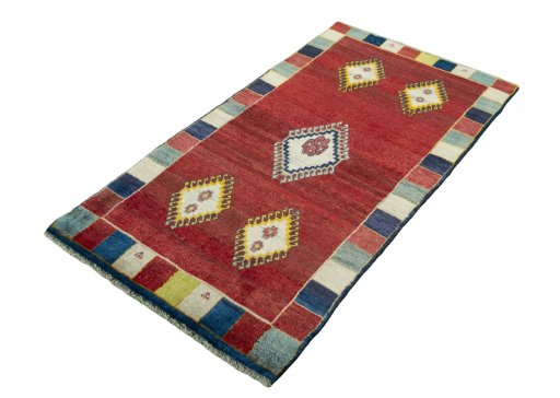 Corner detail of 2000s Persian Gabbeh rug showing border pattern and Wool pile
