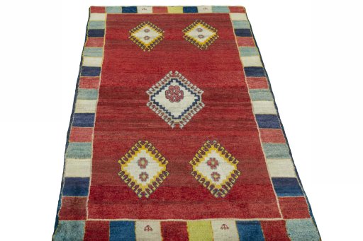 Surface texture of 2000s Persian Gabbeh rug with natural Wool and intricate pattern