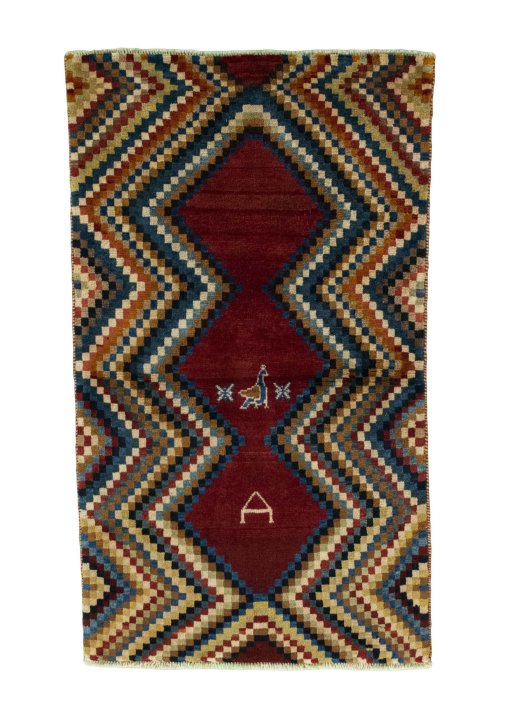Full view of 2000s Persian Gabbeh rug from Iran / Persia, 137 × 81 cm in Red tones