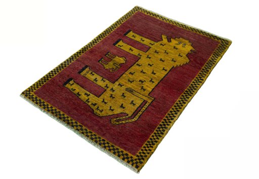 Corner detail of 2000s Persian Gabbeh rug showing border pattern and Wool pile