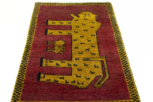 Surface texture of 2000s Persian Gabbeh rug with natural Wool and intricate pattern