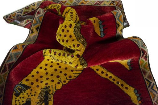 Corner detail of 2000s Persian Gabbeh rug showing border pattern and Wool pile