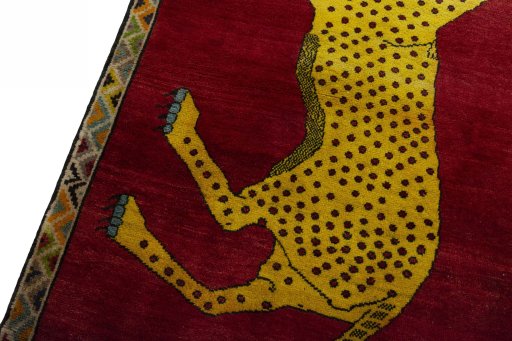 Backside of handmade 2000s Persian Gabbeh rug showing knot structure and weave density