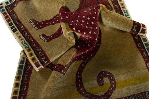 Corner detail of 2000s Persian Gabbeh rug showing border pattern and Wool pile