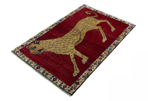 Corner detail of 2000s Persian Gabbeh rug showing border pattern and Wool pile