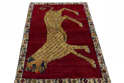 Surface texture of 2000s Persian Gabbeh rug with natural Wool and intricate pattern