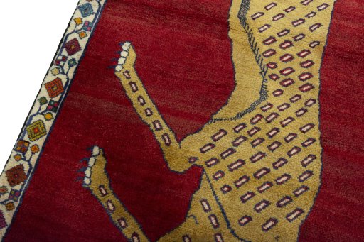 Backside of handmade 2000s Persian Gabbeh rug showing knot structure and weave density