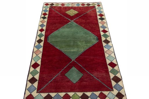 Surface texture of 2000s Persian Gabbeh rug with natural Wool and intricate pattern