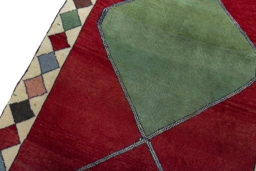 Backside of handmade 2000s Persian Gabbeh rug showing knot structure and weave density
