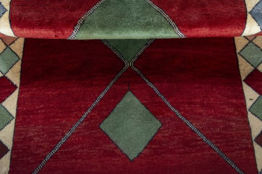 Full view of 2000s Persian Gabbeh rug from Iran / Persia, 187 × 99 cm in Red tones