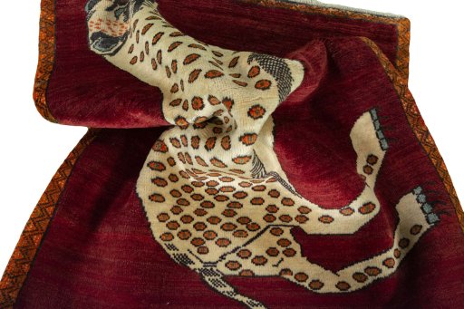 Corner detail of 2000s Persian Gabbeh rug showing border pattern and Wool pile