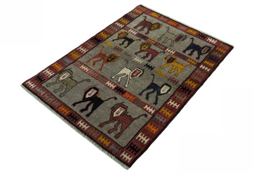 Corner detail of 2000s Persian Gabbeh rug showing border pattern and Wool pile