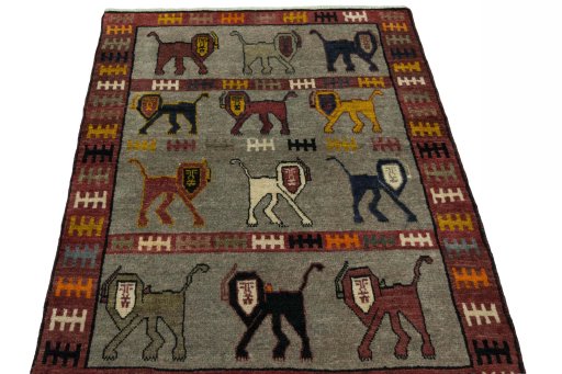 Surface texture of 2000s Persian Gabbeh rug with natural Wool and intricate pattern