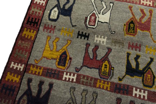 Backside of handmade 2000s Persian Gabbeh rug showing knot structure and weave density