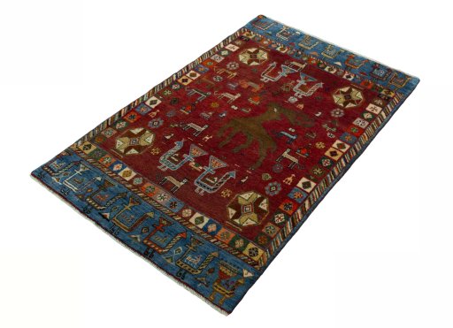 Corner detail of 2000s Persian Gabbeh rug showing border pattern and Wool pile