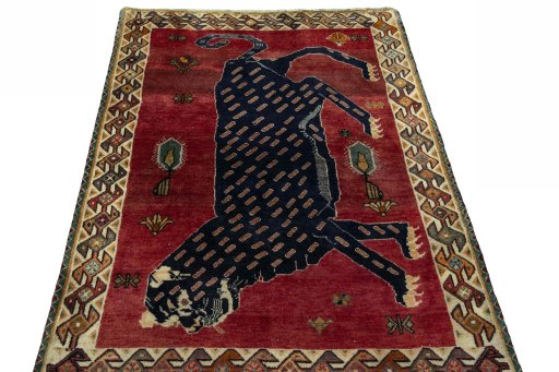 Surface texture of 2000s Persian Gabbeh rug with natural Wool and intricate pattern