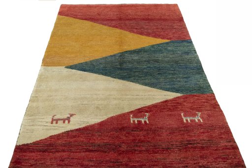 Surface texture of 2000s Persian Gabbeh rug with natural Wool and intricate pattern
