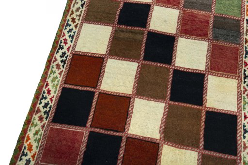 Backside of handmade 2000s Persian Gabbeh rug showing knot structure and weave density