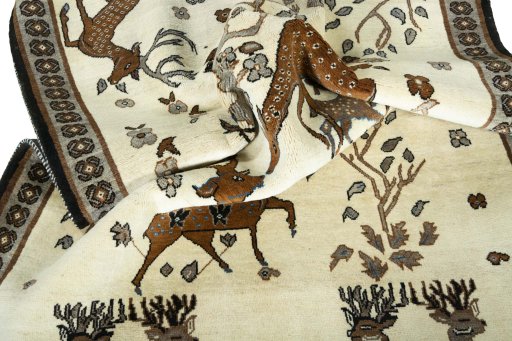 Corner detail of 2000s Persian Gabbeh rug showing border pattern and Wool pile