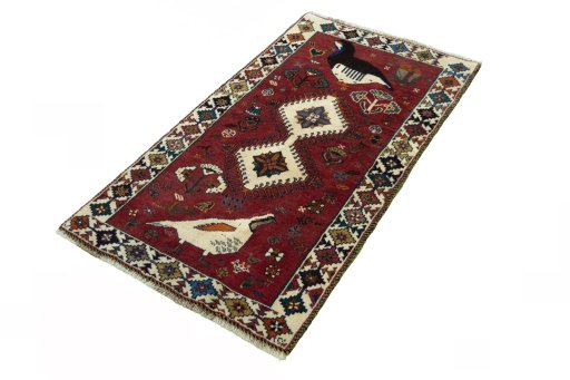 Corner detail of 2000s Persian Gabbeh rug showing border pattern and Wool pile