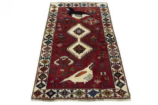 Surface texture of 2000s Persian Gabbeh rug with natural Wool and intricate pattern