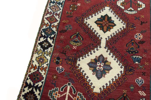 Backside of handmade 2000s Persian Gabbeh rug showing knot structure and weave density