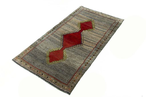 Corner detail of 2000s Persian Gabbeh rug showing border pattern and Wool pile