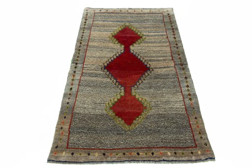 Surface texture of 2000s Persian Gabbeh rug with natural Wool and intricate pattern
